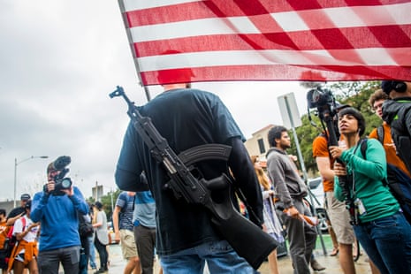 Gun activists march close to The University of Texas campus December 12, 2015 in Austin, Texas. In addition to the event put on by DontComply.com, a gun activist organization, the group also held an open carry walk earlier in the day.