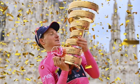 Britain’s Tao Geoghegan Hart poses with the trophy after winning the Giro d’Italia.