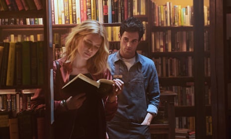 Elizabeth Lail and Penn Badgley in You.