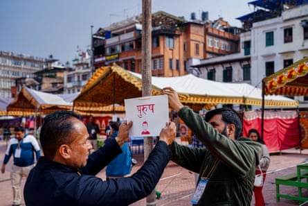 Volunteers set up voting booths at a polling station in Kathmandu