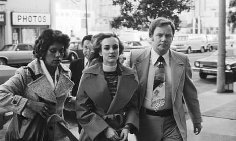 Patty Hearst is led into court in February 1976. She was found guilty of armed robbery and sentenced to seven years