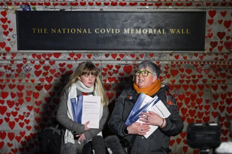 Brenda Doherty, who lost her mother on March 24, 2020, and Lauren Mallon, who lost her uncle during the pandemic, as members of Covid-19 Bereaved Families for Justice UK gather, on the day the Covid-19 Inquiry publishes its second report into the pandemic, at the Covid Memorial Wall in London, Britain, November 20, 2025.