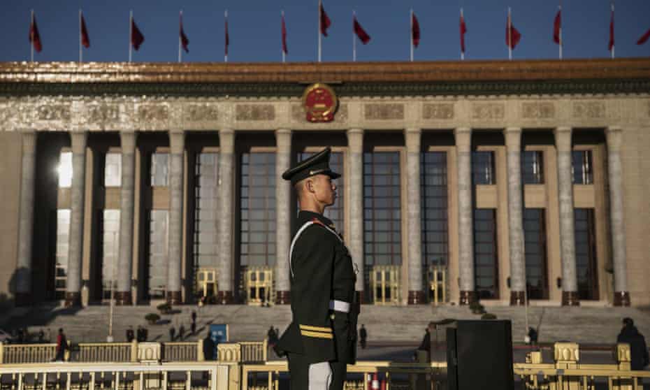 A member of the People’s Armed Police stands guard at The Great Hall Of The People in Beijing, China