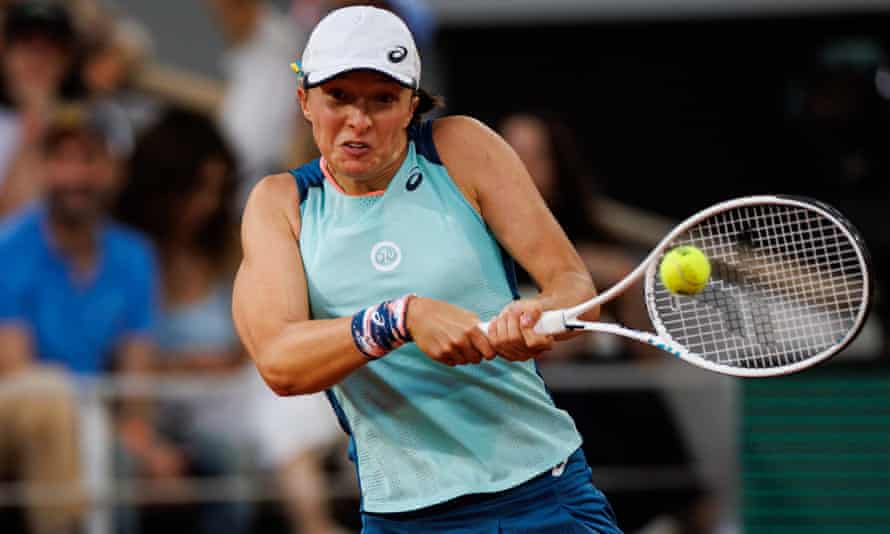 Iga Swiatek of Poland hits a backhand against Coco Gauff of the United States in the women’s singles final at the French Open.