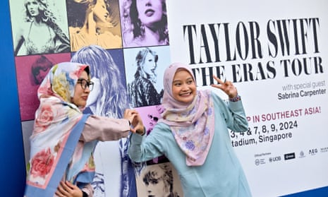 Swifties pose for a picture at the National Stadium in Singapore during Taylor Swift's Eras tour.