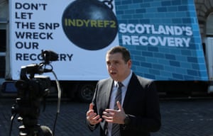 Douglas Ross launching a Scottish Conservative election poster last week.