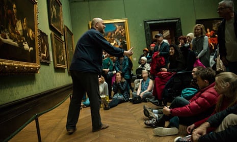 A National Gallery educator talks to visitors