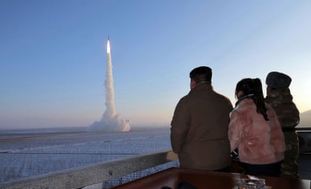 Kim Jong-un and Kim ju-ae watch a missile launch.