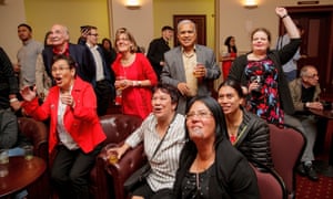 Labour supporters cheer as they watch the results come in during the New Zealand Labour party election night event in Auckland