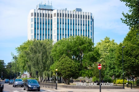 Twelve-storey steel-clad tower rises above trees