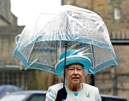 The Queen holds transparent umbrella in Lancaster in May 2015.