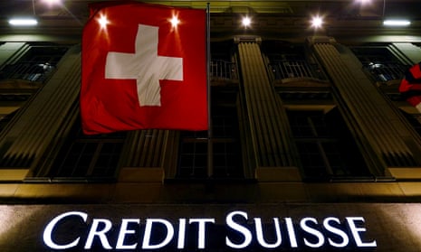 The Credit Suisse logo below the Swiss national flag at Federal Square in Bern, Switzerland