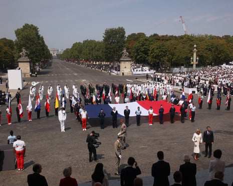 A French flag is on display after the Bastille Day military parade on the Champs-Elysees avenue, in Paris.
