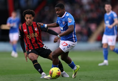 Sunderland's Noah Sadiki fends off Tyler Adams.
