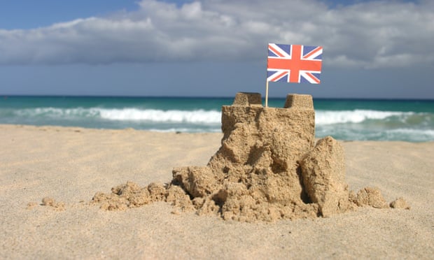A sandcastle with a British flag in the Canary Islands, Spain.