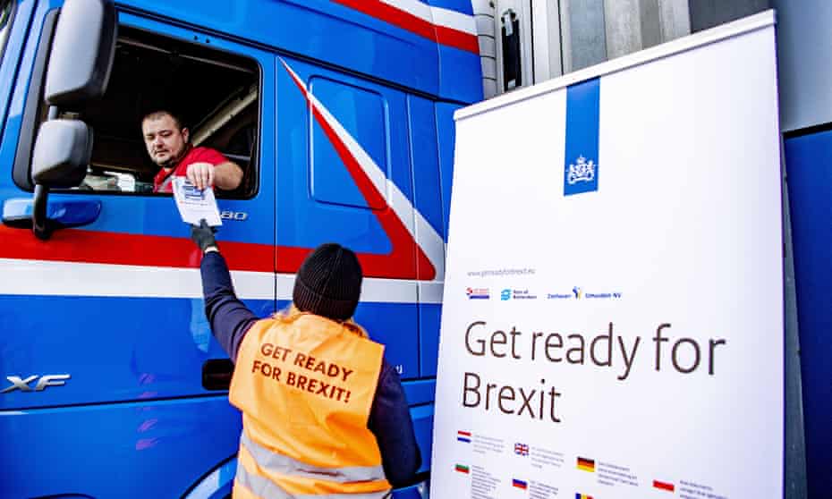 Campaigners hand out flyers to truck drivers at the terminal of a ferry operator in the port of Rotterdam, on 1 December as part of the Get Ready For Brexit campaign. 