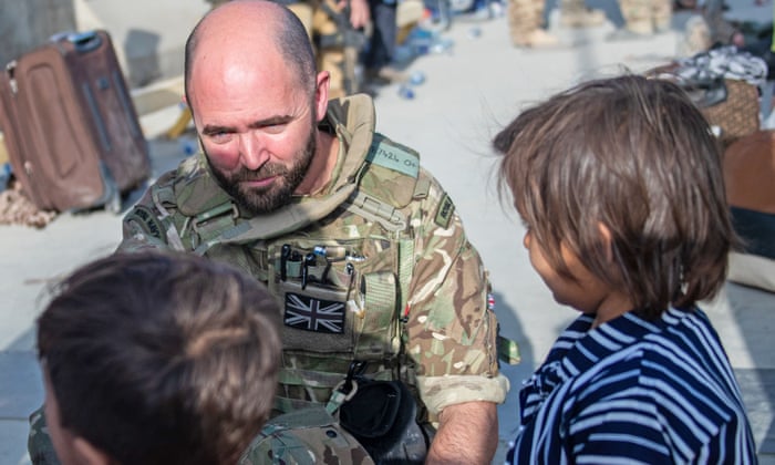 British soldier with children