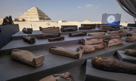 People look at ancient sarcophagi on display, discovered in a vast necropolis in Saqqara, Giza, Egypt