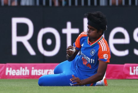 India's Arundhati Reddy taking a drawback to disregard England's Tammy Beaumont.