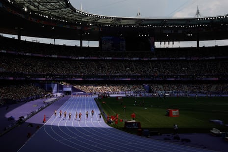 A general view of the women’s 100m heats as sunlight spills over the roof at Stade de France.