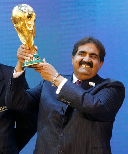 Sheikh Hamad holding the World Cup trophy in 2010, after the announcement that Qatar would host the 2022 event.