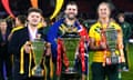 Australia's James Tedesco (centre) with the men's trophy, Australia's Kezie Apps (right) with the women's trophy and England's Tom Halliwell with the wheelchair trophy after the Rugby League World Cup final in 2022