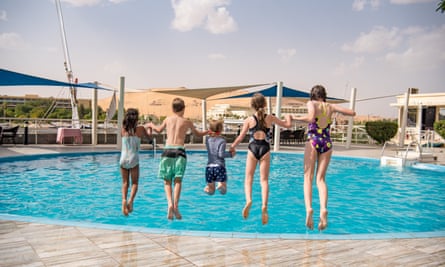 The kids jumping into the pool in their Nile-side Aswan hotel.
