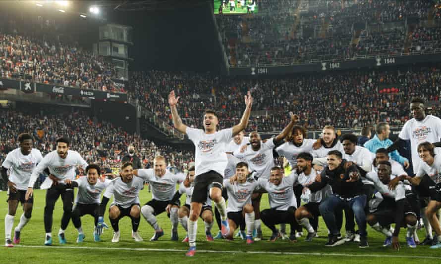 Valencia players celebrate after beating Athletic Bilbao to reach the Copa del Rey final.