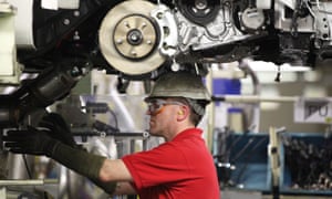 A worker assembles a vehicle on the production line at Toyota’s factory in Burnaston, Derbyshire.