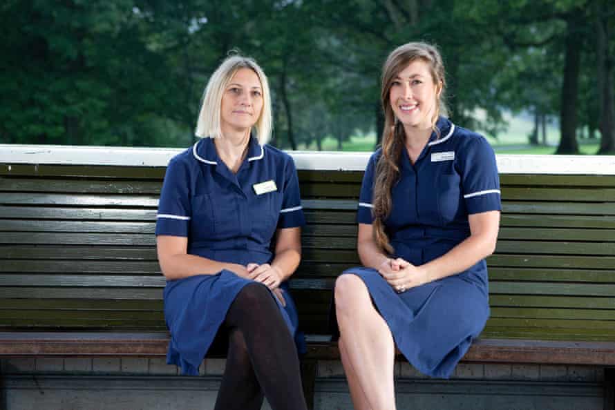 Midwives Andrea Taylor, left, and Nicole Ackie sitting on a bench