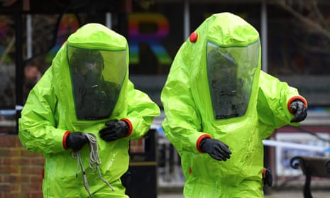 Members of the emergency services in green biohazard encapsulated suits work at the bench in Salisbury where former Russian spy Sergei Skripal and his daughter Yulia were found in critical condition.