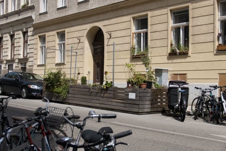 A small on-street parket with bikes parked next to it