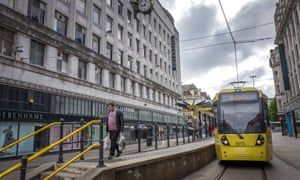 A tram at a stop in Manchester city centre earlier this month.