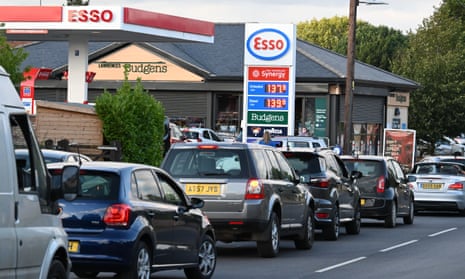 Cars queue for petrol in Harleston, Norfolk, as food and fuel supply chains are hit by the HGV driver shortage.