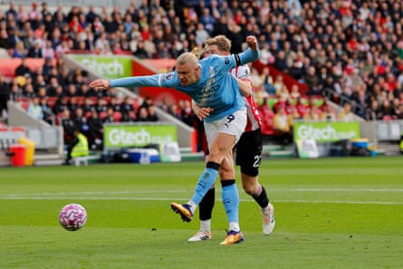Erling Haaland holds off the challenge of Nathan Collins to score the only goal of the game in Manchester City’s victory at Brentford