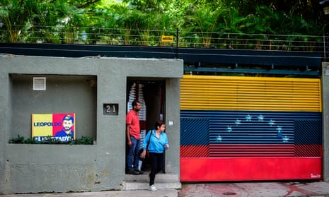 A woman leaves the house of Venezuelan opposition leader Leopoldo Lopez in Caracas, just hours after he was taken away from his home by the intelligence service.
