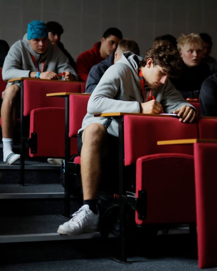 Niko Kampas (centre front), an offensive lineman from Dusseldorf in Germany, squeezes into a chair in the lecture theatre for a seminar on finance for the NFL Academy at Loughborough College.