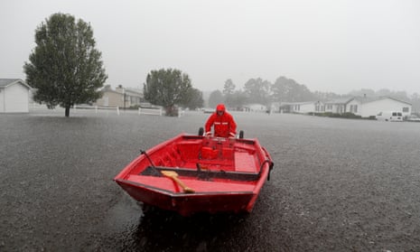 US Coast Guard Petty Officer Don Tantanella patrols a neighborhood during Tropical Storm Florence in Lumberton, North Carolina