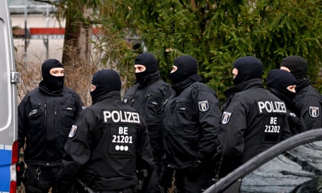 Police officers during a raid in Berlin on Wednesday