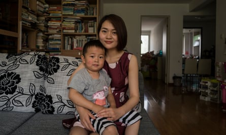 Li Wenzu, 31, wife of imprisoned lawyer Wang Quanzhang poses with their son Wang Guangwei, aged three.