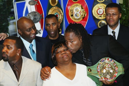 Lennox Lewis kisses his mother after announcing his retirement during a press conference at London’s Grosvenor House Hotel on February 2004.