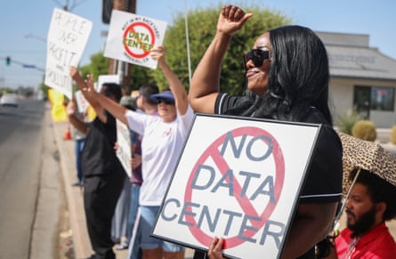 Demonstrators wave signs during a nationwide protest against AI data center expansion in Imperial, California on July 18, 2026.