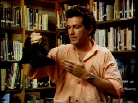 Richard Morecroft holds Archie, an orphaned baby flying fox