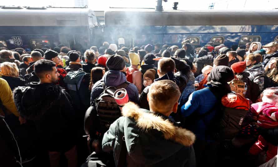 People wait to board a evacuaition train from Kyiv to Lviv.