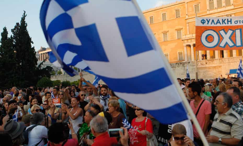 Supporters of the NO vote in the upcoming referendum hold a banner with colors of the Greek flag reading ‘’NO, OXI’’ during a rally at Syntagma. 