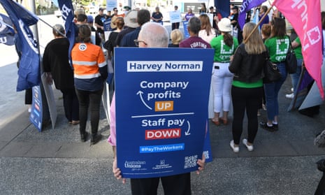 Workers protesting about pay outside Harvey Norman at Fortitude Valley in Brisbane