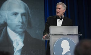 Supreme court justice Neil Gorsuch speaks at the Federalist Society’s 2017 convention in Washington, watched by James Madison.