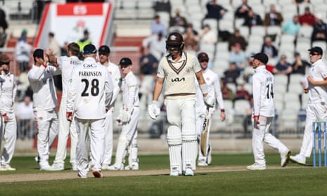Surrey's Sean Abbott trudges off the field after losing his wicket against Lancashire in their County Cricket match.