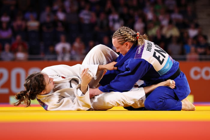 Catherine Beauchemin-Pinard of Team Canada (left) competes with Gemma Howell of Team England.