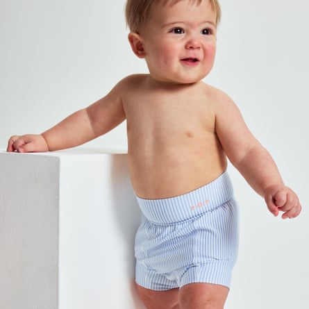 A child wears a Polarn O Pyret Striped swim diaper